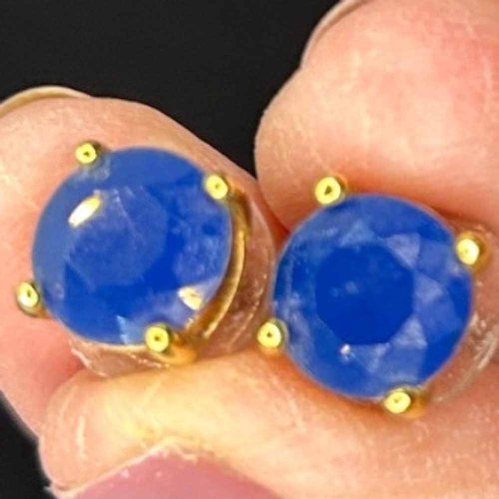 Blue Round stud earrings faceted stone set‎ in four prong Gold tone metal